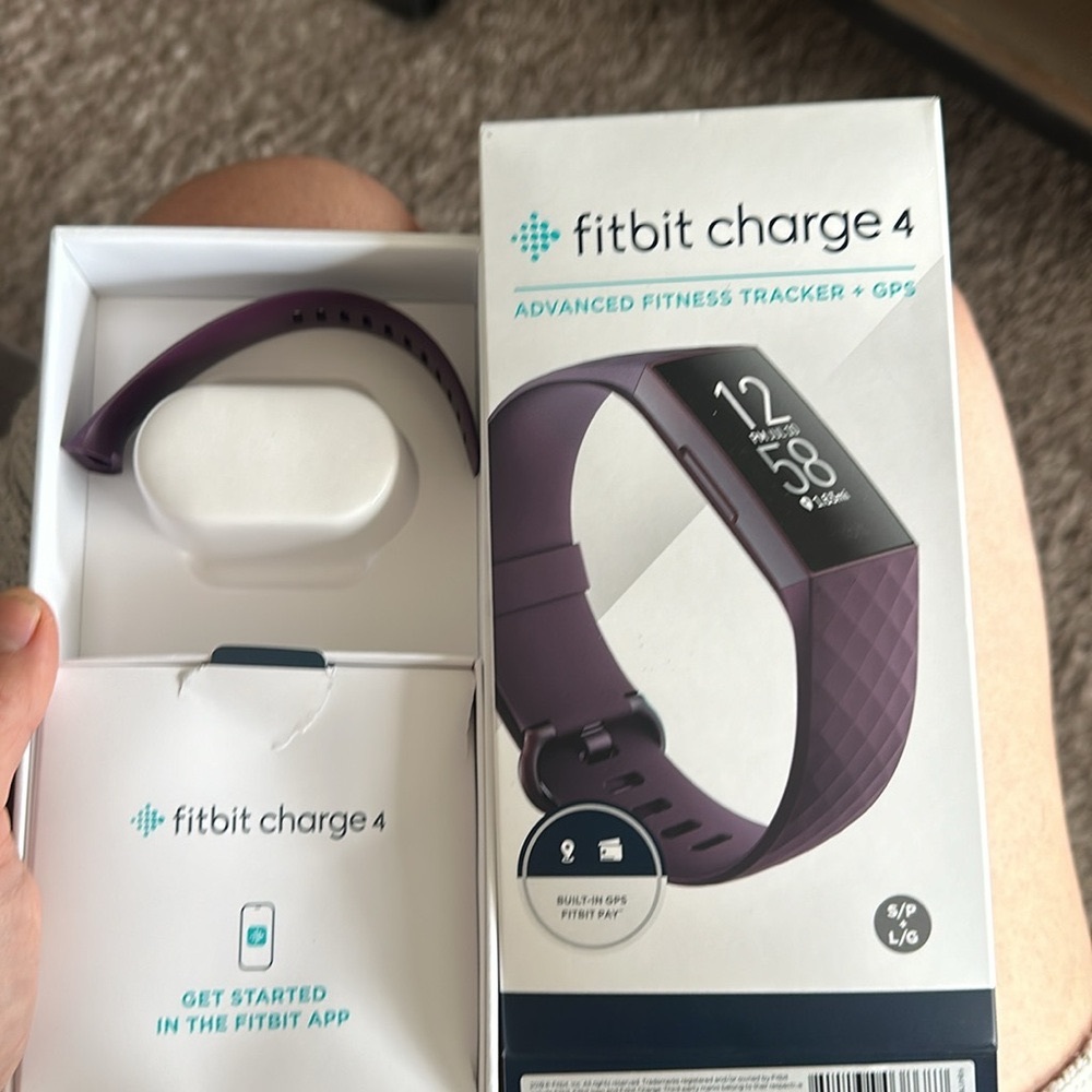 Fitbit charge 4 with charger additional band and original box